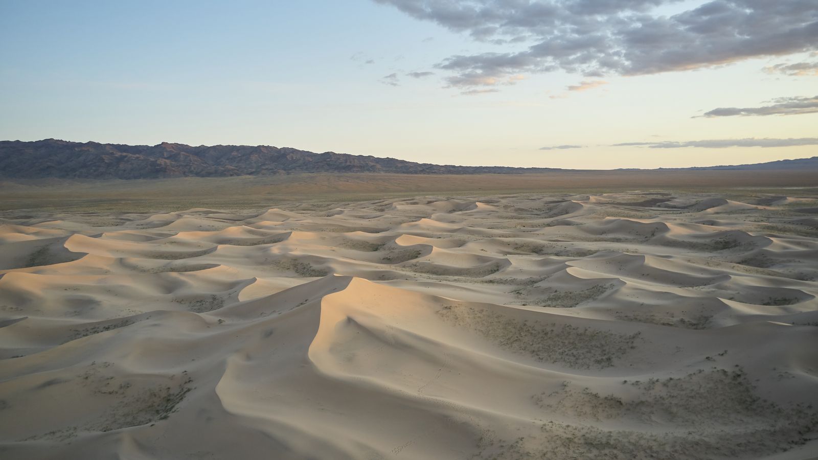 Sand dunes and distant mountains near Sevrei in southern Mongolia.