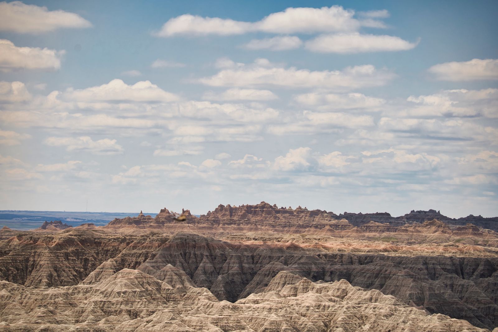 Layered rock formations stretch across Badlands National Park in South Dakota.