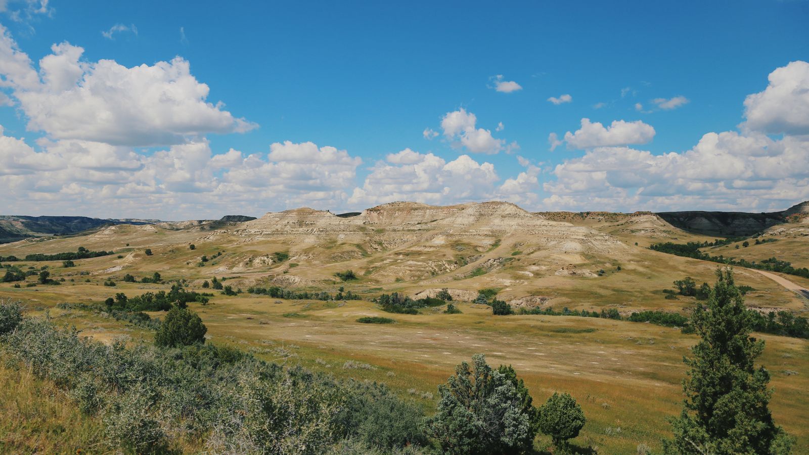 Prairie and eroded badlands in Theodore Roosevelt National Park, North Dakota.