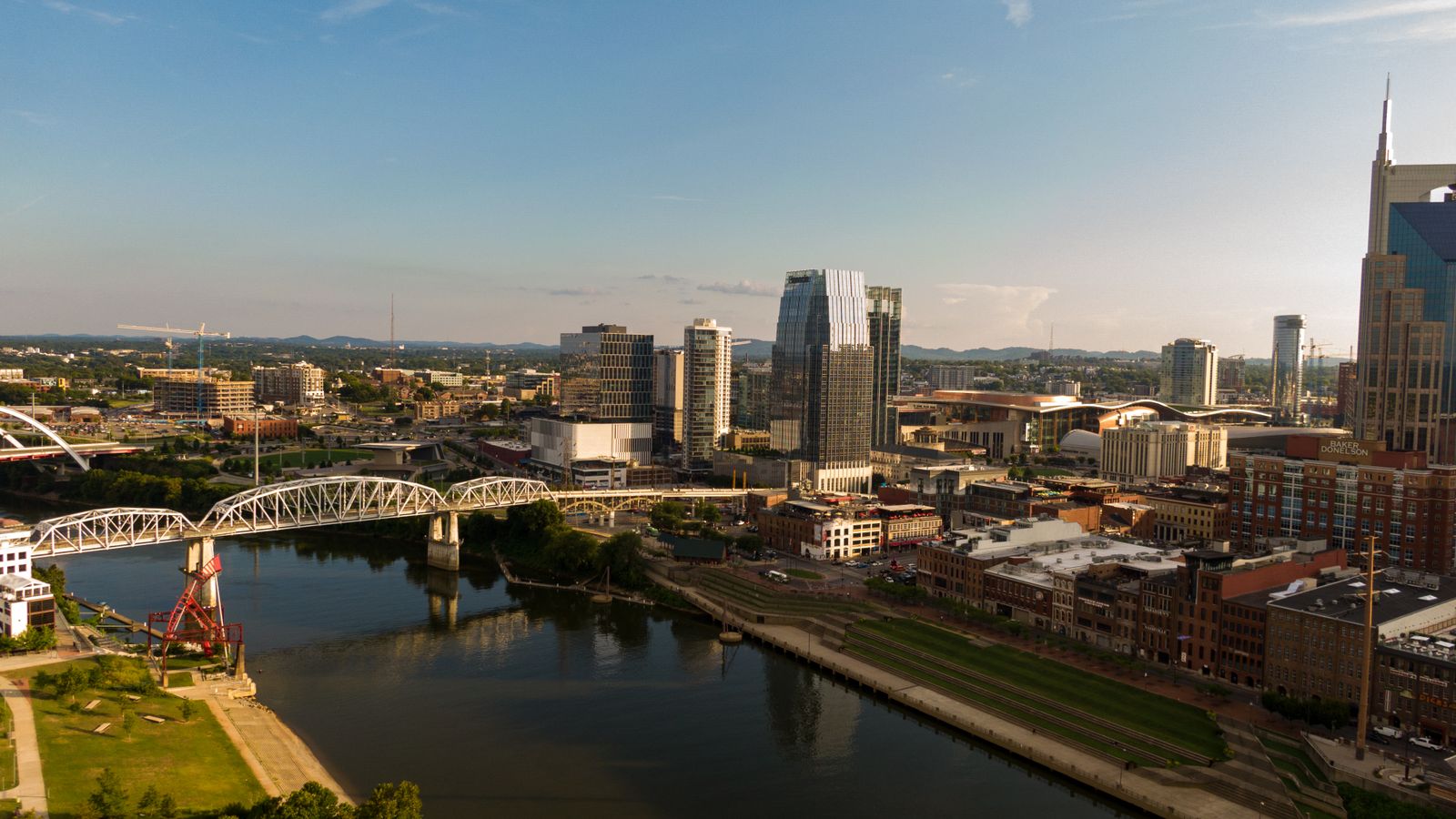 Nashville skyline and river, with bridges in the foreground.