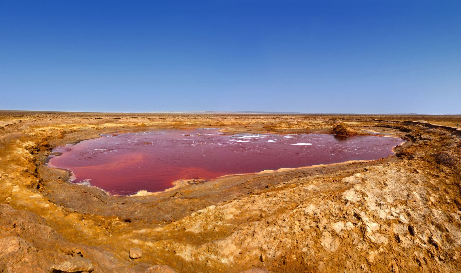 Vivid red geothermal pool in the Danakil Depression, Ethiopia