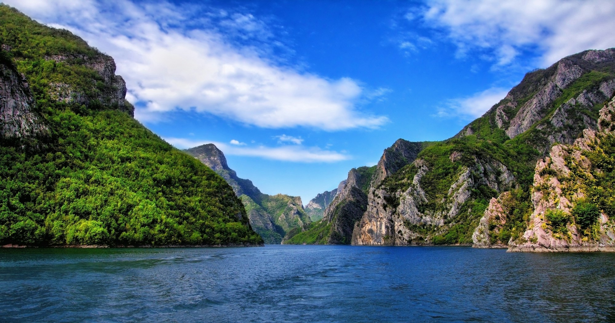 Green canyon lake and ferry landscape in Albania
